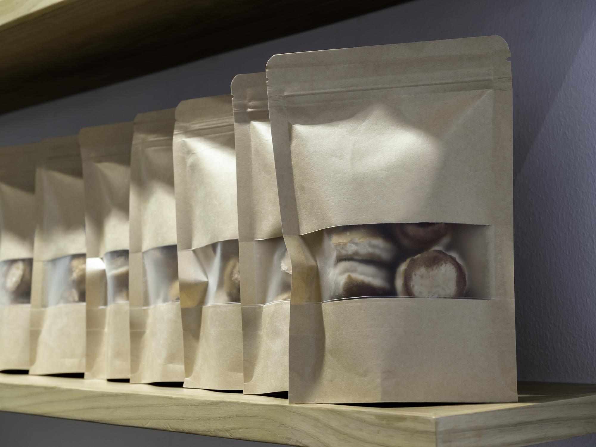 Stack of sealed ingredient pouches with simple labels